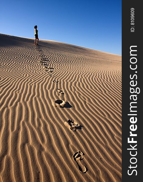 Girl Walking In Desert