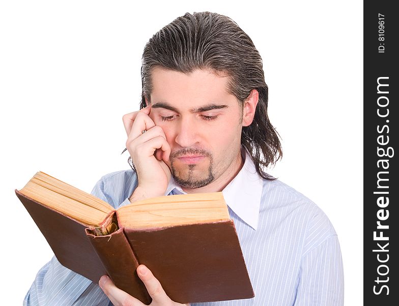 Young dark haired caucasian man in light blue shirt reads book and scratches his head in confusion isolated on white. Young dark haired caucasian man in light blue shirt reads book and scratches his head in confusion isolated on white