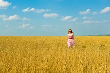 Happy Girl Walks Over The Field. Royalty Free Stock Photos Happy Girl Walks Over The Field. Royalty Free Stock Photos