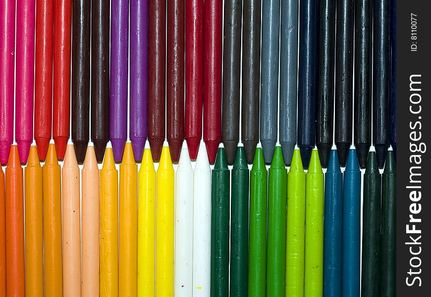 View of a bunch of colorful crayons in line
