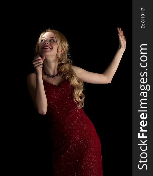 Beautiful blonde young lady in red dress singing. Beautiful blonde young lady in red dress singing