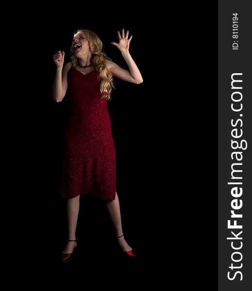 Beautiful blonde young lady in red dress singing. Beautiful blonde young lady in red dress singing