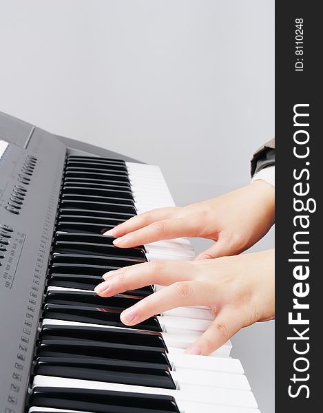 Two hands playing music on electronic organ. Two hands playing music on electronic organ