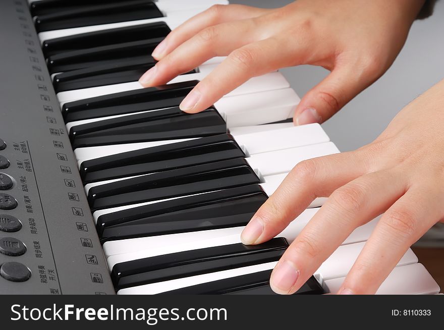Two hands playing music on electronic organ. Two hands playing music on electronic organ