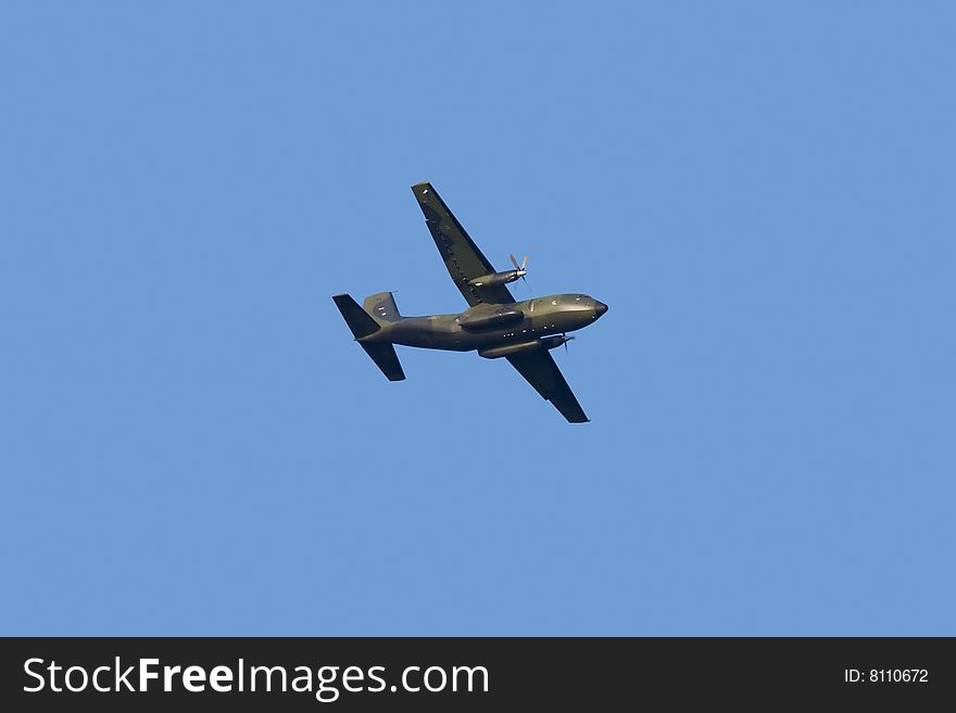 Military propeller aircraft flying in a clear skies. Military propeller aircraft flying in a clear skies