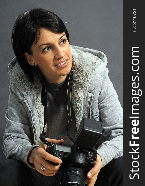 Woman with camera over gray background