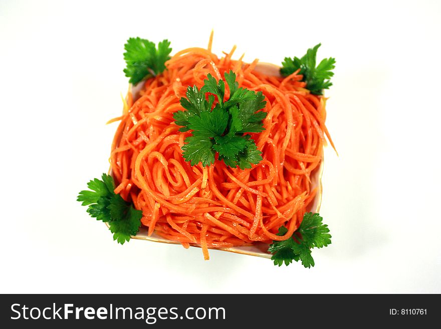 Lettuce from a carrot and parsley in a light-green dish