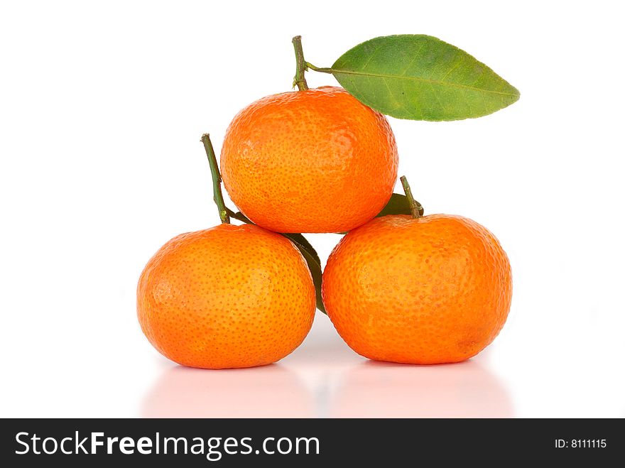 Orange with leaves on white background