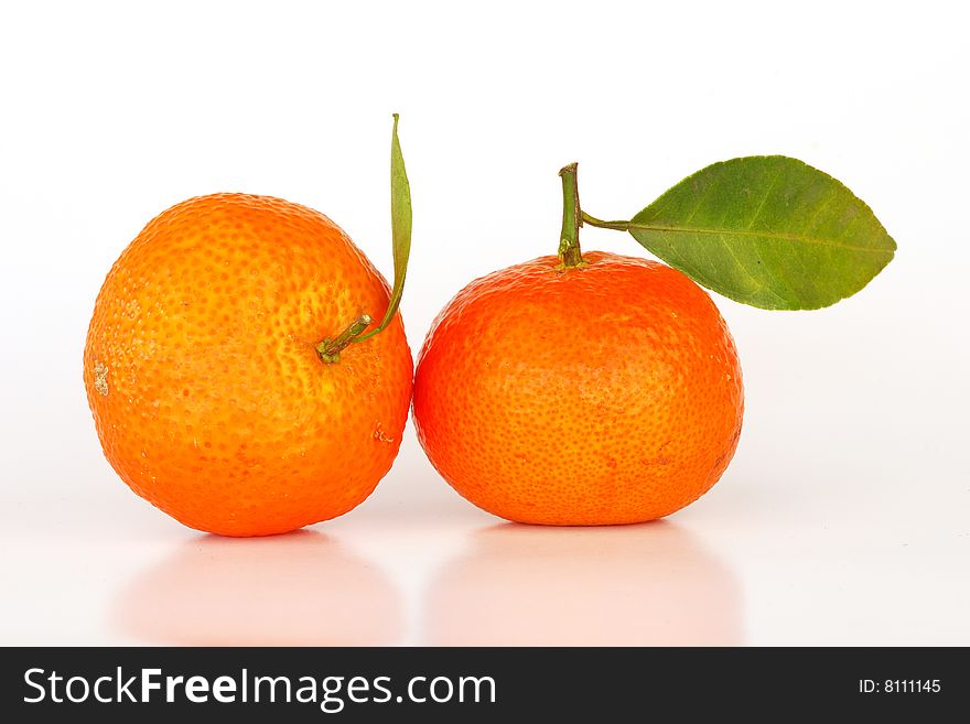 Orange with leaves on white background