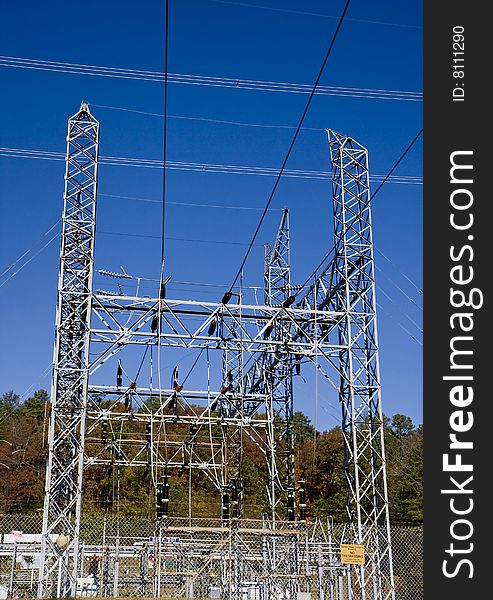 A high power electric station under a blue sky. A high power electric station under a blue sky
