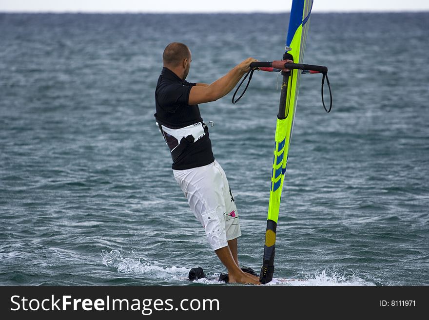 Fast moving windsurfer on the water at Turkey.
