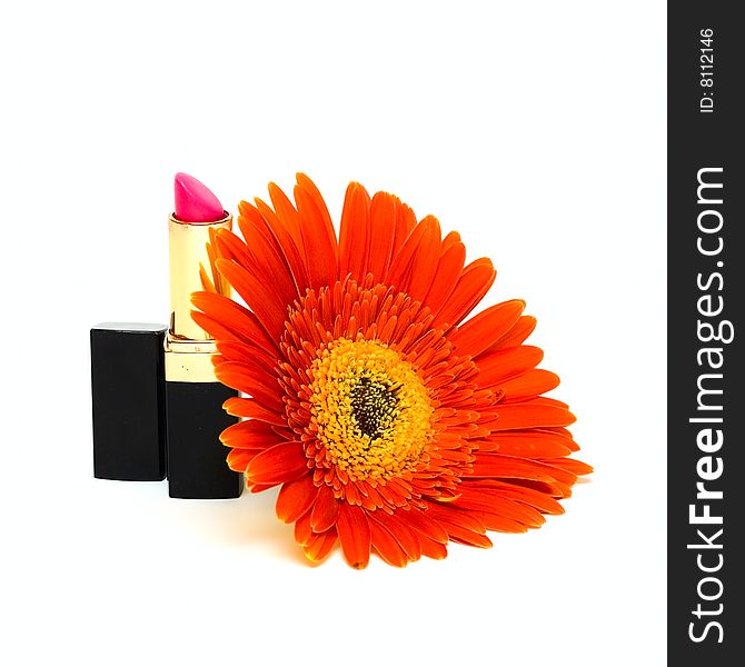 Woman lipstick and flower isolated on white