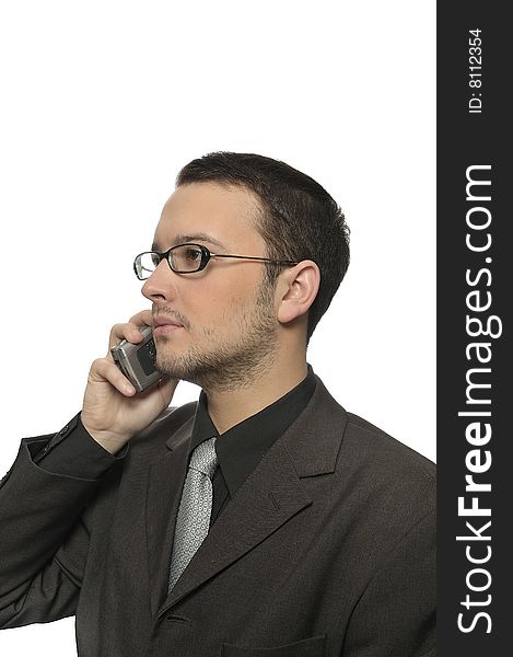 Young successful businessman making a business phone call