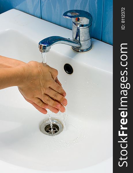 Washing hands in bathroom for your design