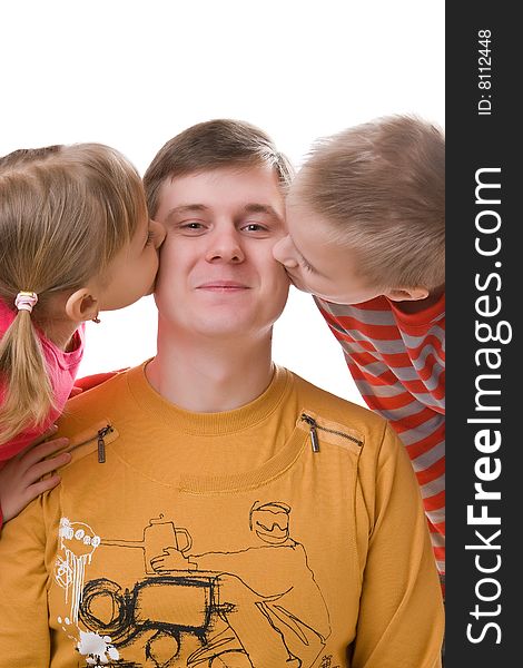 Children kiss the father on a cheek