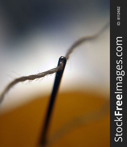 Macro image of a Thread and needle. Macro image of a Thread and needle