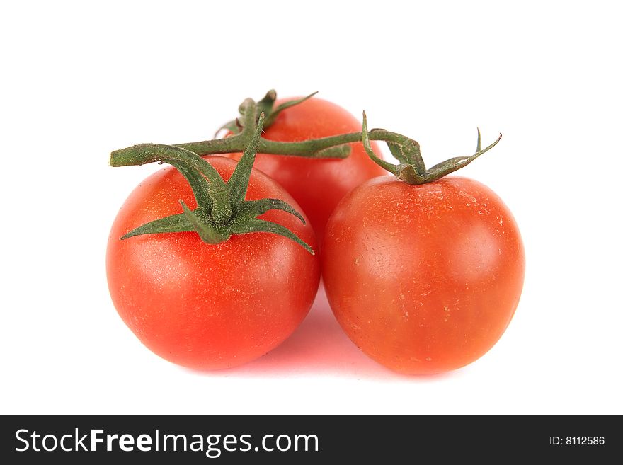 Macroshot of a bunch of tomatoes. Isolated over white background. Lot of copyspace. Macroshot of a bunch of tomatoes. Isolated over white background. Lot of copyspace.