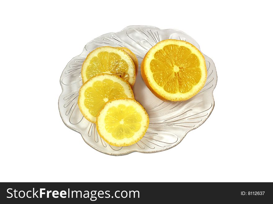 Ripe yellow lemon on a white background in a dish. Ripe yellow lemon on a white background in a dish