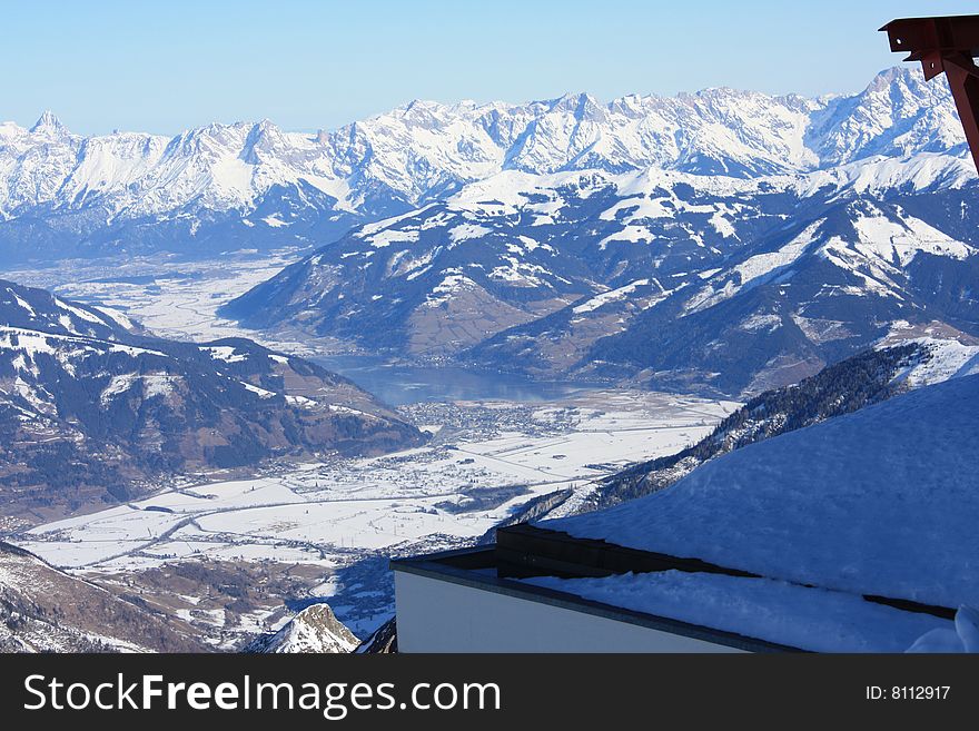 Austria. Mountains. The Alpes.Snow. The sun. Mountain tops.City in mountains. Mountain lake.