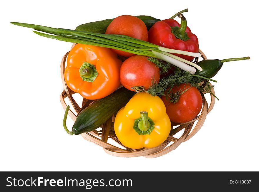 Crude vegetables in a basket - it is isolated on a white background. Crude vegetables in a basket - it is isolated on a white background.