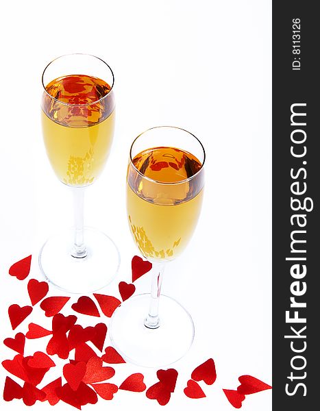 Two wine glasses and red small hearts