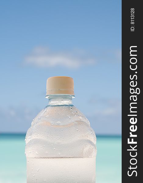 Cold Bottle Of Water On Beach