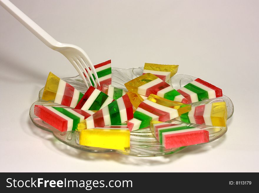 Fruit jelly is cut a triangle in a dish