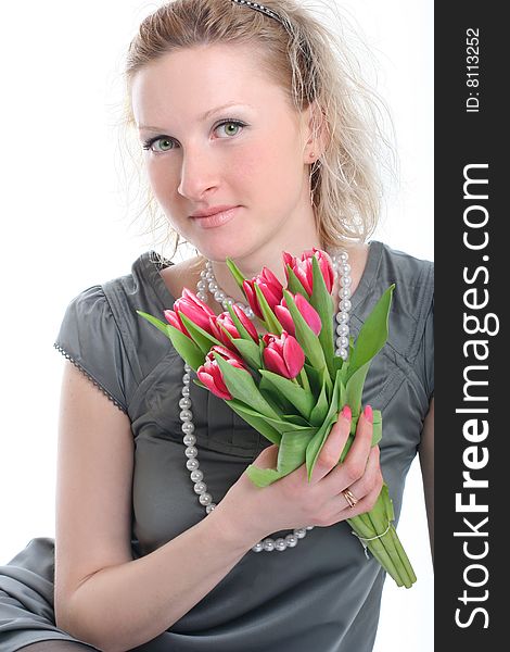 Beautiful young woman with pink tulips. Beautiful young woman with pink tulips