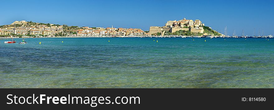 blue water and Calvi castle in Corsica. blue water and Calvi castle in Corsica