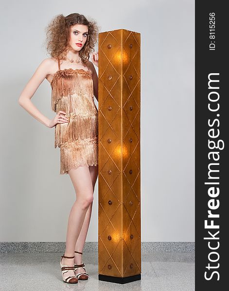 Model Standing With A Lamp