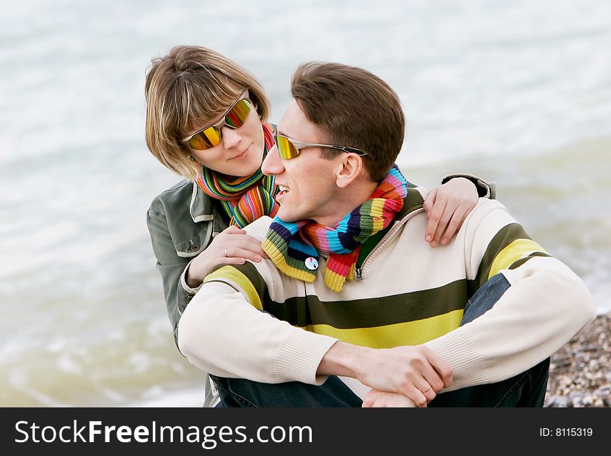 Young couple on sea background