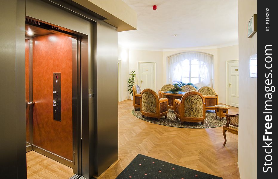 Modern elevator and a hotel lounge