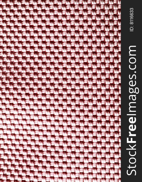 A close-up of the texture of red nylon fabric. A close-up of the texture of red nylon fabric