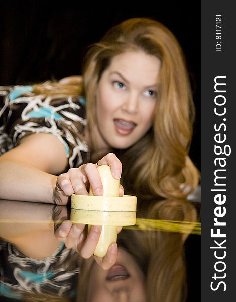 Woman with Happy Expression While Playing Air Hockey Game. Woman with Happy Expression While Playing Air Hockey Game