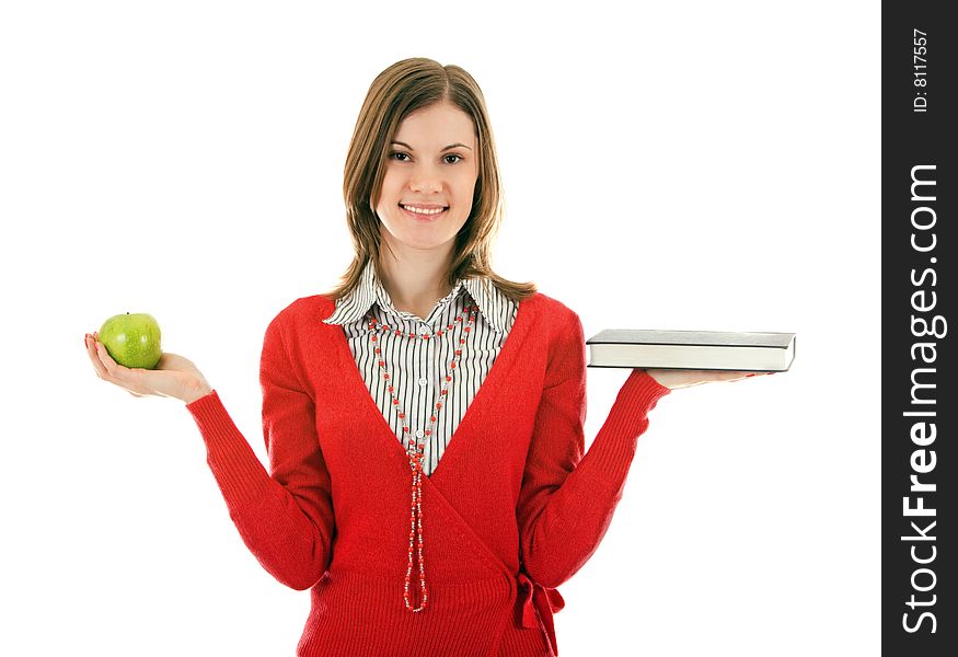 Smiling girl with an apple and a book; isolated on white