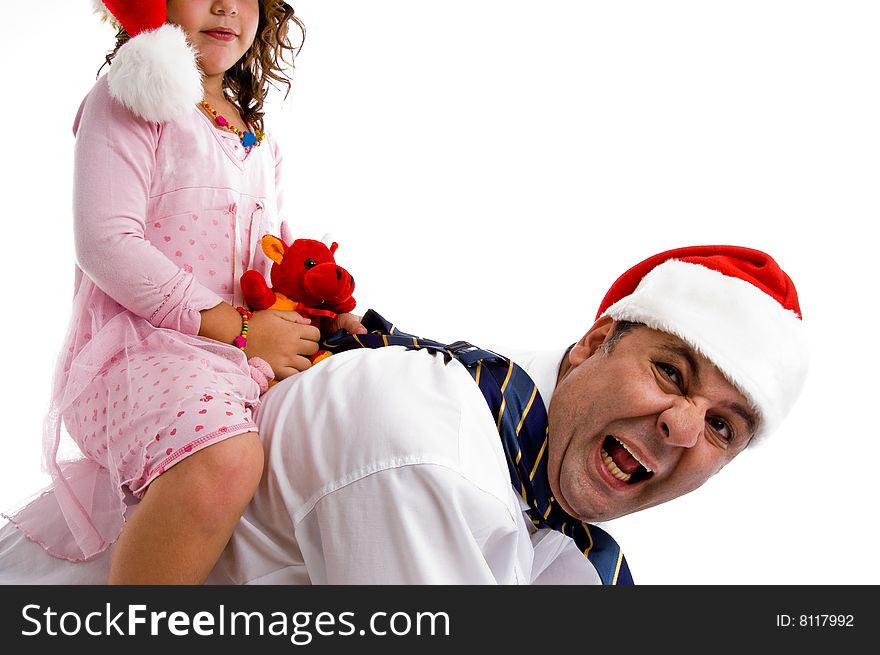 Girl holding her toy riding on father's back isolated with white background. Girl holding her toy riding on father's back isolated with white background