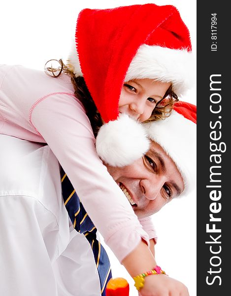 Girl riding on father's back having fun against white background