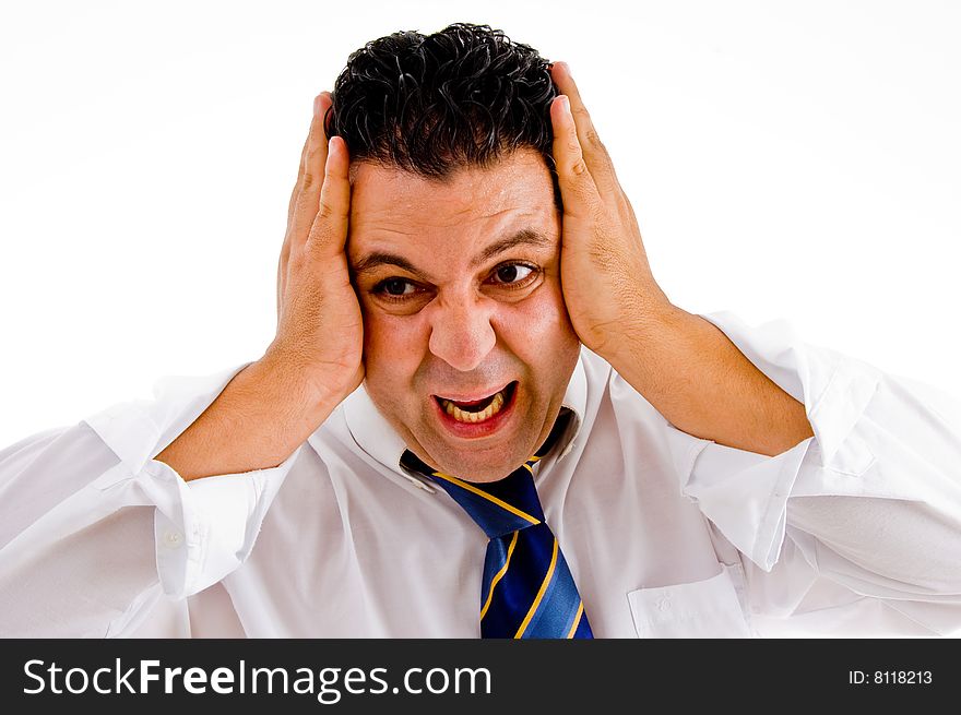 Irritated business executive with hands on his head on an isolated white background