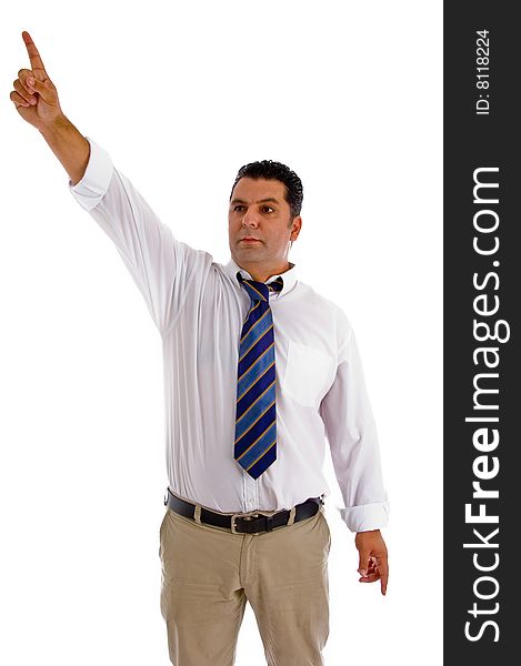 Serious businessman pointing sideway against white background