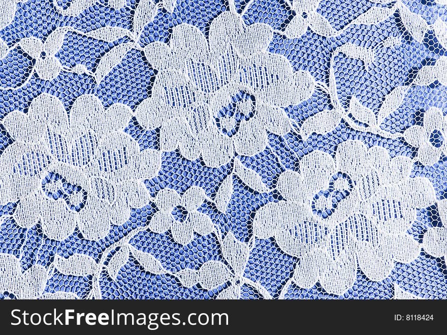 Patterns in white lace on a blue background. Patterns in white lace on a blue background