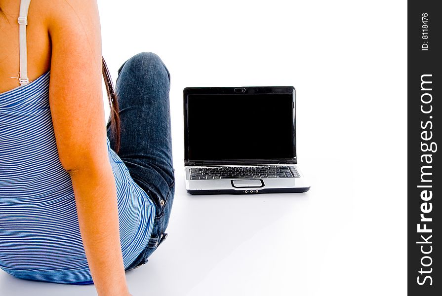 Back pose of female student and laptop against a white background