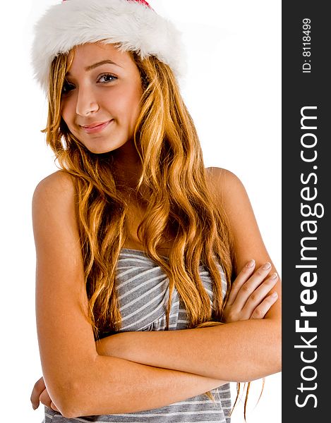 Young girl with folded hands with christmas hat