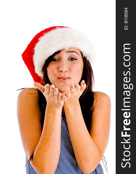 Charming female wearing christmas hat and giving you flying kiss with white background. Charming female wearing christmas hat and giving you flying kiss with white background