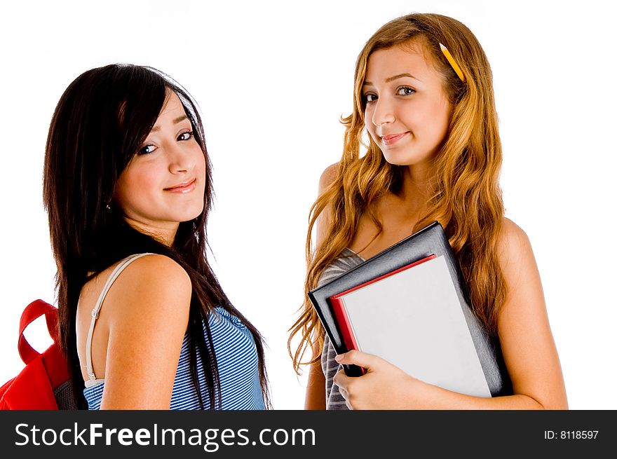 Smiling students posing with bag and books on an isolated white background