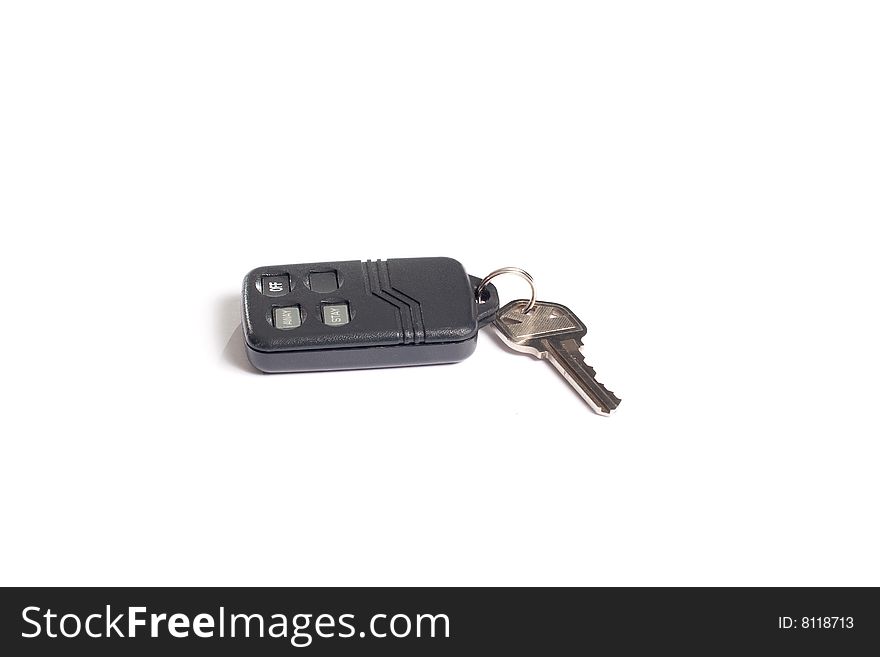 House key with an alarm isolated on white. House key with an alarm isolated on white.