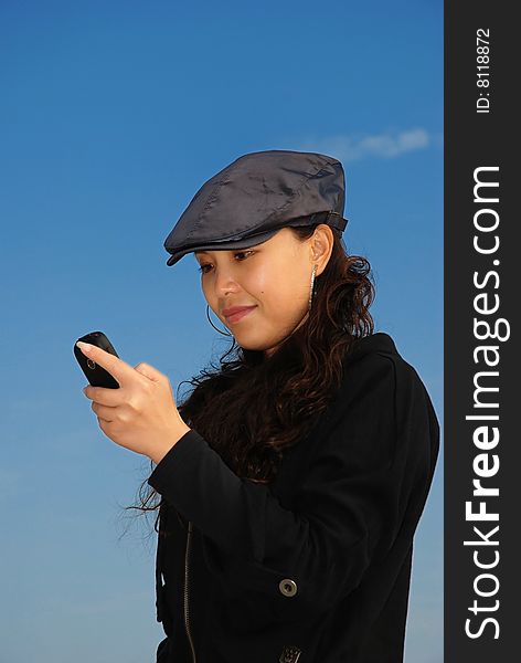 Stylish Asian Woman reading sms with happy smile. Stylish Asian Woman reading sms with happy smile