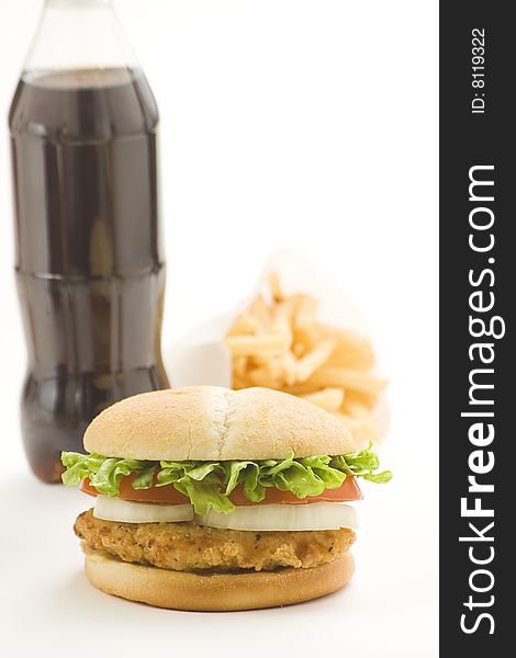 Crisp chicken burger with tomato onion cheese lettuce isolated. Crisp chicken burger with tomato onion cheese lettuce isolated