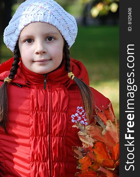 Portrait of little girl in the white stocking little cap