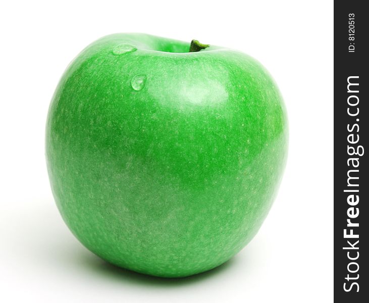 Green juicy apple with waterdrops over white. Green juicy apple with waterdrops over white