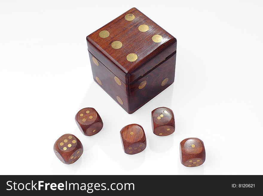Wooden playing dice on white with clipping path